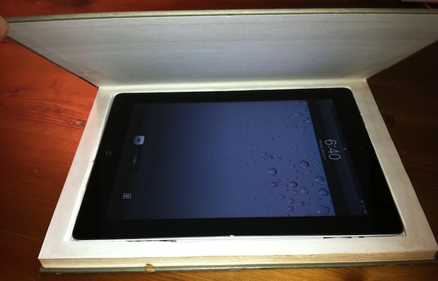 The iPad is completely usable inside the book case: