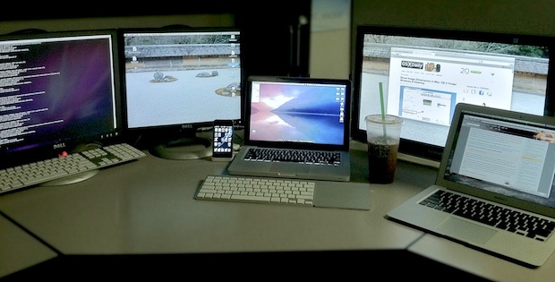 Many Macs at a desk