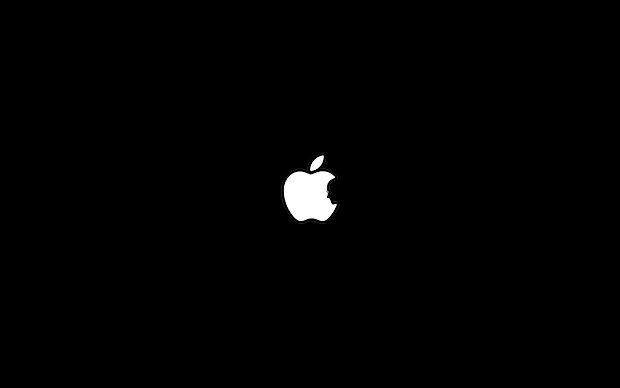 Steve Jobs silhouette within the Apple logo