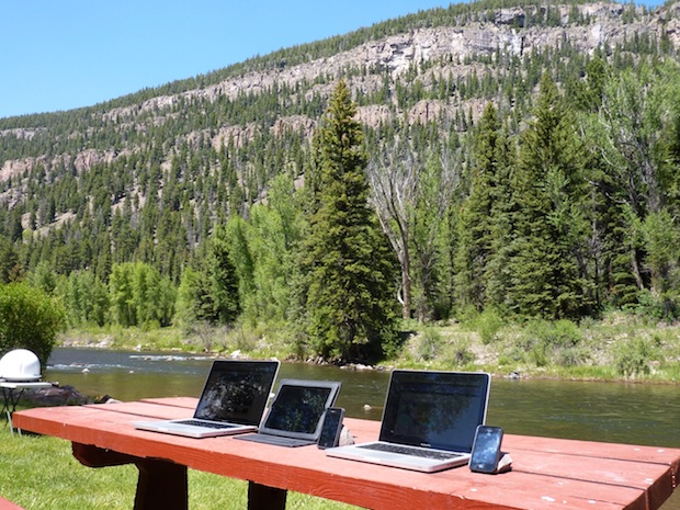 Macs, riverside, at a campground. We're jealous.